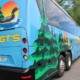 back view of a Voigt bus featuring a loon, with it's door open