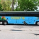 Side view of a Voigt bus featuring a loon, Minnesota state outline, and other Minnesota elements